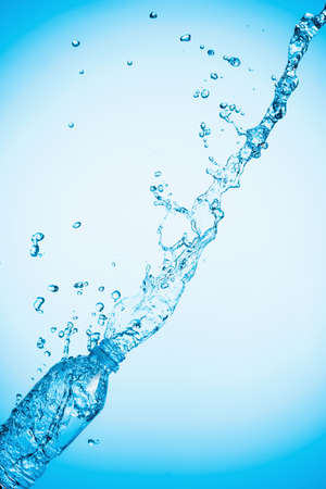 Water is poured out of a plastic bottle. Copy space.の写真素材