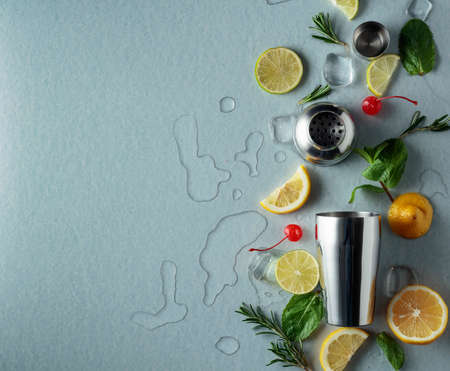 Shaker with ingredients for making cocktails. Blue background with copy space. Top view.の写真素材