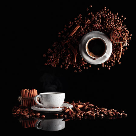 Black coffee in a white cup with coffee beans, cinnamon sticks, and star anise. Concept image with a black background. Copy space.の写真素材