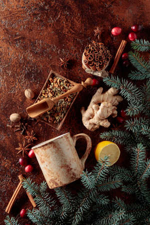 Mug and ingredients for making a winter hot drink on vintage background. Top view.の写真素材
