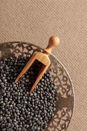 Raw uncooked black lentils (lens culinaris). Top view with copy space.の写真素材