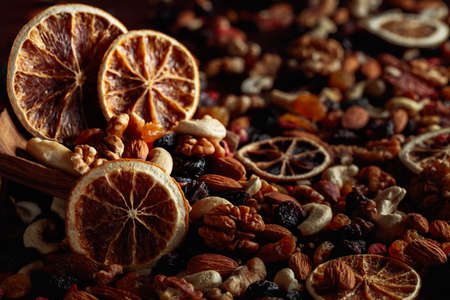 Dried fruits and nuts. Presented raisins, walnuts, almonds, goji berries, hazelnuts, cashews, and...