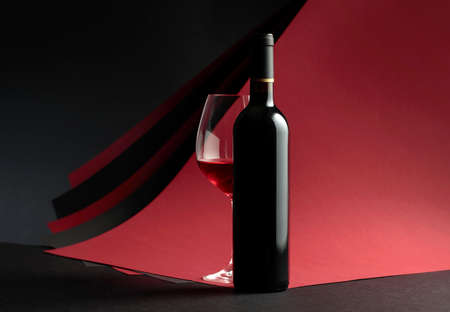 Bottle and glass of red wine. Copy space for your text.の写真素材