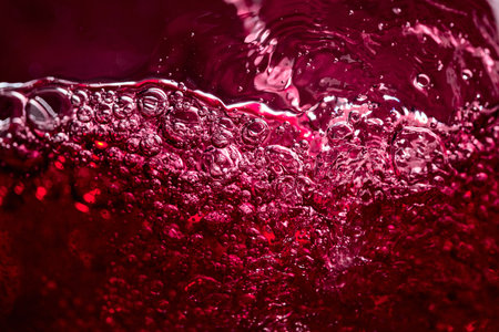 Abstract splashing of red wine. Macro shot.の写真素材