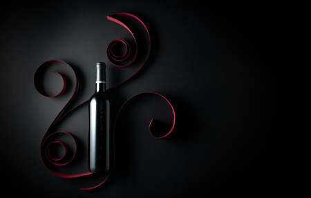 Bottle of red wine on a black background. Top view.の写真素材