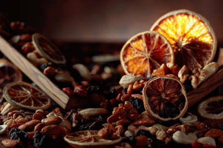 Dried fruits and nuts. Presented raisins, walnuts, almonds, goji berries, hazelnuts, cashews, and...