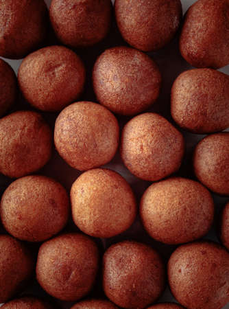 Balls of freshly baked homemade cottage cheese doughnuts. Top view.の写真素材