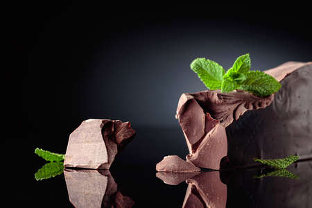 Large piece of dark bitter chocolate with mint. Copy space.の写真素材