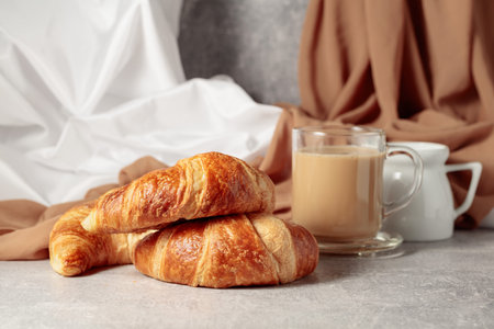 Freshly baked croissants and coffee with cream.の写真素材