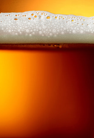 Glass of tasty beer with foam, closeup. Macro shot.の写真素材