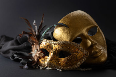 Golden  carnival masks. Vintage masks on a black background.の写真素材