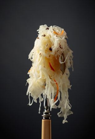 Traditional German sauerkraut with spices on a fork.の写真素材