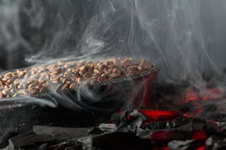 Roasting coffee beans. Black background with copy space.の写真素材