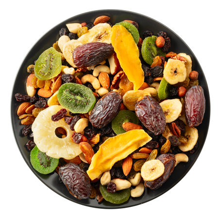 Dried tropical fruits with various nuts and raisins isolated on a white background.の写真素材