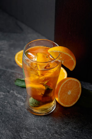 A summer refreshing drink with ice, mint, and orange.の写真素材