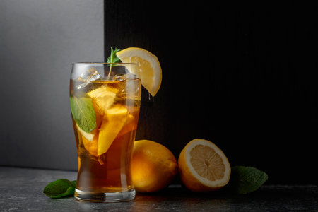 A summer refreshing drink with ice, mint, and lemon. Copy space.の写真素材