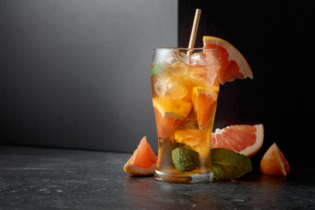 Hard seltzer or a summer refreshing drink with ice, mint, and grapefruit. Copy space.の写真素材