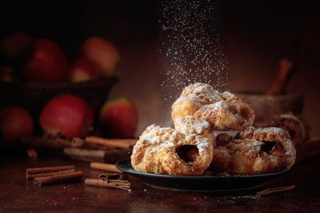 Homemade mini apple strudels with apples and cinnamon. Fresh baked goods sprinkled with powdered sugar. Viennese pastry.の写真素材