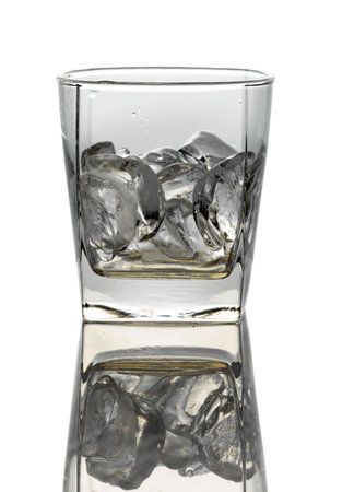 Whiskey with ice in a glass. Isolated on a white background.の写真素材