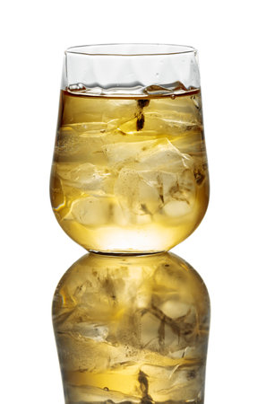 Whiskey with ice in a glass. Isolated on a white background.の写真素材