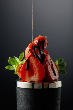 Fresh strawberries are drizzled with melted dark chocolate.の写真素材