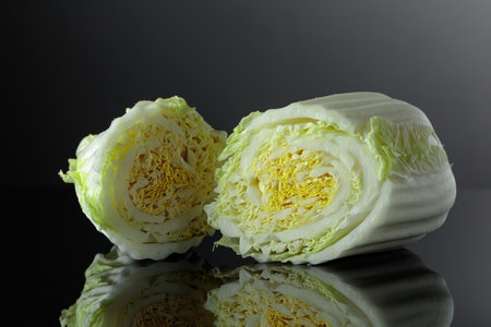 Fresh Chinese cabbage on a black reflective background.の写真素材