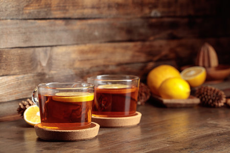Tea with lemon on a wooden table. Copy space.の写真素材