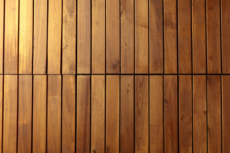 Decorative surface made of brown wooden slats. Natural wooden background.の写真素材