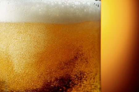 Glass of tasty beer with foam, closeup. Copy space.の写真素材