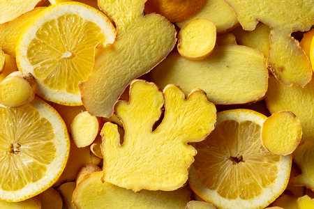 Close-up of fresh ginger and lemon slices. Top view.の写真素材