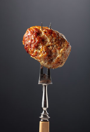 Homemade pork-beef cutlet in rustic style on a black background.の写真素材