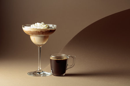 Black coffee and iced coffee cocktail on a beige background. Copy space.