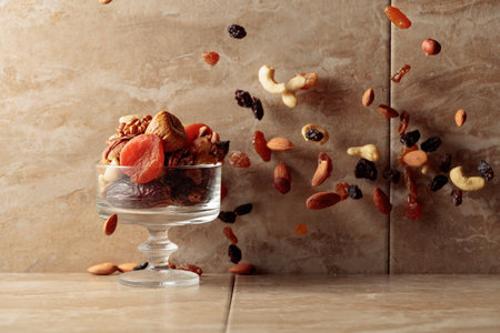 Mix of dried fruits and nuts in motion. Copy space.の写真素材