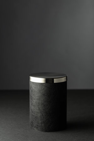 Black podium on a black background. Platform for showing your products. Copy space.の写真素材