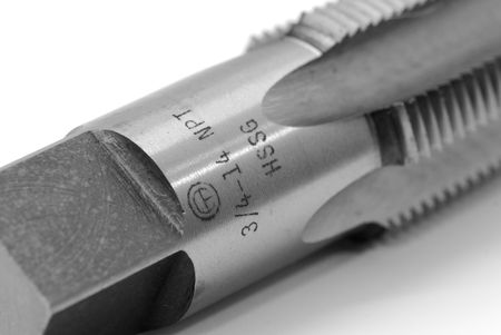 A screwing tap on the white backgroundの写真素材