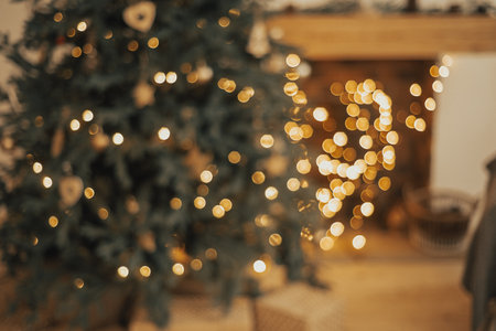 New Year background. Christmas Room Interior Design, Xmas Tree Decorated By Lights Presents Gifts Toys, Candles And Garland Lighting Indoorsの写真素材