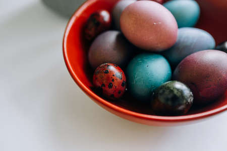 Easter eggs in a red plateの写真素材
