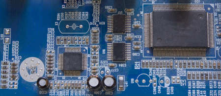 Electronic circuit board with chip, close up.