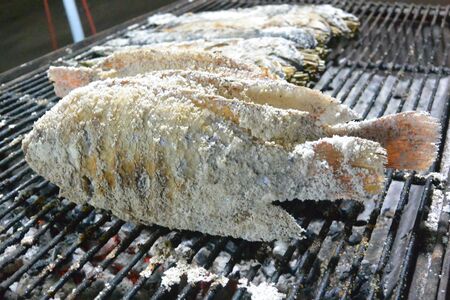 Char grilled lake fish Tilapia in salt