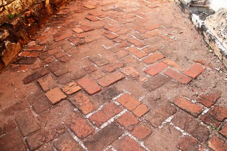11 Old orange brick footpath in a Buddhist temple, Cambodia