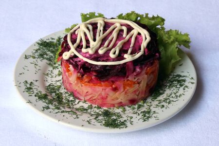 Herring under a fur coat with mayonnaise, dishes of Russian national cuisine, restaurant, servingの写真素材