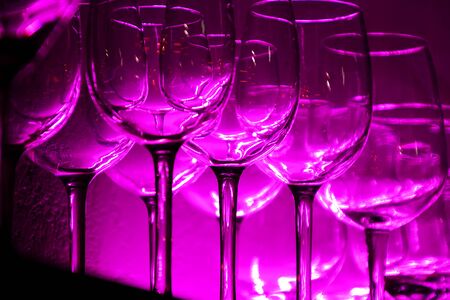 12 Wine glasses and glasses on a shelf in a barの写真素材