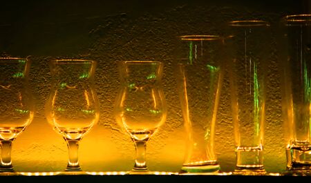 1 Wine glasses and glasses on a shelf in a barの写真素材