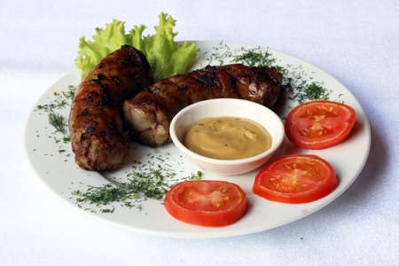 Fried pork sausages with mustard, dishes of Russian national cuisine, restaurant, servingの写真素材