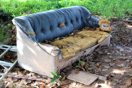Old broken sofa thrown in the trash, Cambodiaの写真素材