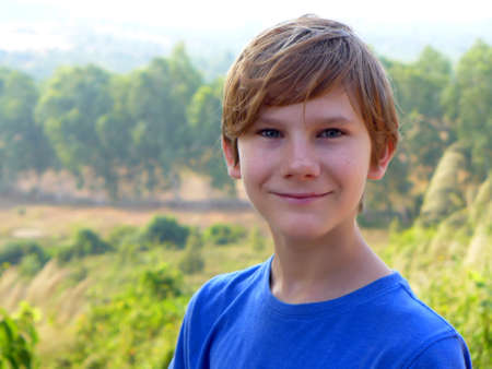 Smiling boy in blue t-shirtの写真素材