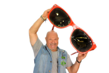 Brutal bearded man 1 holds huge glasses in his hands.の写真素材