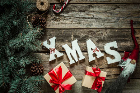 Christmas gifts on wooden background, Christmas tree, top viewの写真素材