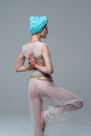 white lingerie girl doing yogaの写真素材