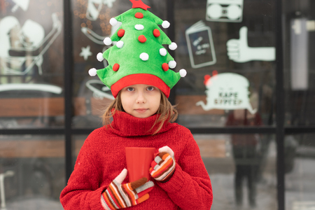 portrait of a little girl outdoors in winter at christmasの写真素材